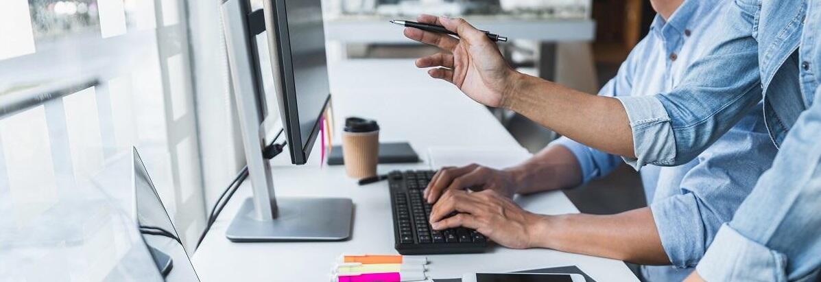 office men typing on desk.jpg